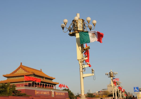 Chinese and Mexican national flags flutter on a lamppost on the Tiananmen Square during the 2014 Asia-Pacific Economic Cooperation (APEC) CEO Summit in Beijing, China, 12 November 2014 (Oriental Image via Reuters Connect)