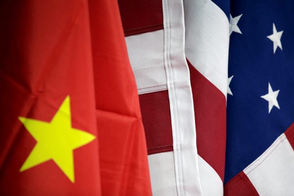 Flags of United States and China are displayed at American International Chamber of Commerce (AICC)'s booth during China International Fair for Trade in Services in Beijing, China, 28 May 2019 (Photo: Reuters/Jason Lee).