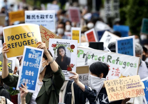 People opposing the revision of Japan's immigration control and refugee recognition law march in Tokyo, Japan, 16 May 2021 (Photo: Reuters/Kyodo).