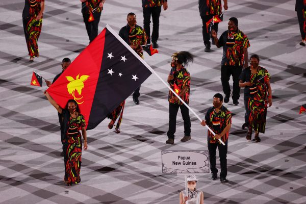 Flag bearers Morea Baru of Papua New Guinea lead their contingent during the athletes parade at the opening ceremony of the Tokyo 2020 Olympics Opening Ceremony, Olympic Stadium, Tokyo, Japan, 23 July, 2021 (Photo: Reuters/Mike Blake).