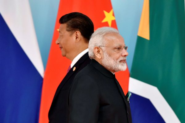 Chinese President Xi Jinping and Indian Prime Minister Narendra Modi attend the group photo session during the BRICS Summit in Xiamen, China 4 September, 2017. (Photo: REUTERS/Kenzaburo Fukuhara/Pool)