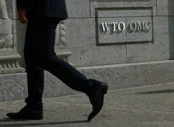 A logo is pictured outside the World Trade Organisation (WTO) in Geneva, Switzerland, 28 September 2021 (Photo:Reuters/Denis Balibouse).