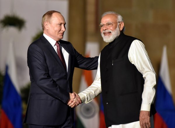 Indian Prime Minister Narendra Modi shakes hands with Russian President Vladimir Putin during their meeting at Hyderabad House, on 6 December 2021 in New Delhi, India. (Sonu Mehta/Hindustan Times/Sipa USA via Reuters Connect)