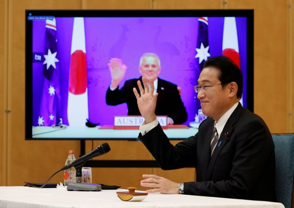 Japan's Prime Minister Fumio Kishida and Australia's Prime Minister Scott Morrison attend a video signing ceremony of the bilateral reciprocal access agreement in Tokyo, Japan, 6 January 2022 (Photo: Reuters/Issei Kato).
