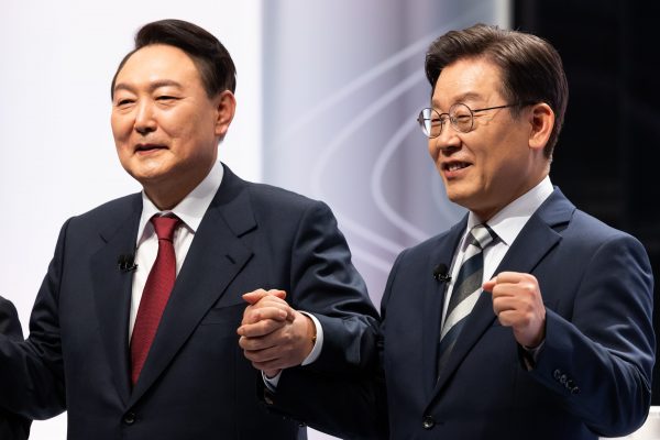 Lee Jae-myung, presidential candidate from the ruling Democratic Party, right, and Yoon Suk-yeol, presidential candidate from the main opposition People Power Party, during a presidential debate at the SBS studio in Seoul, South Korea, 25 February 2022 (Photo: SeongJoon Cho/Bloomberg Pool via Sipa USA).