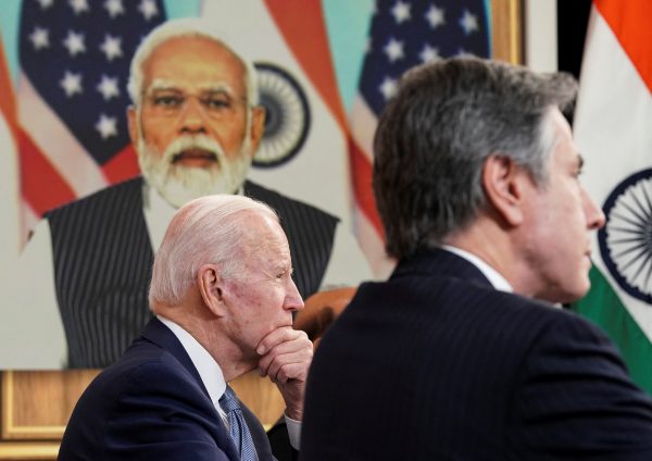 US President Joe Biden holds virtual talks via videoconference with India's Prime Minister Narendra Modi, as US Secretary of State Antony Blinken participates, in the Eisenhower Executive Office Building's South Court Auditorium at the White House in Washington, United States, 11 April 2022 (REUTERS/Kevin Lamarque)
