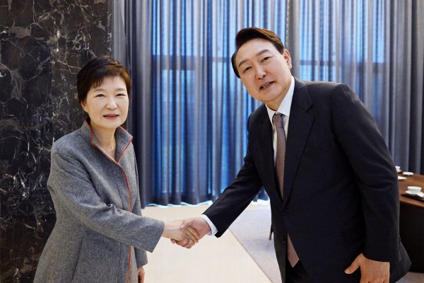 South Korea's President-elect Yoon Suk-yeol shakes hands with former President Park Geun-hye at her house in Daegu, South Korea, 12 April 2022 (Photo: Reuters/Spokeman's Office for Yoon Suk-yeol/Yonhap)