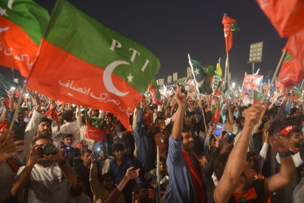 Supporters of former Pakistani Prime Minister Imran Khan attend an anti-government rally in Lahore, Pakistan, 21 April 2022 (Photo: Reuters/Rana Sajid Hussain/Pacific Press/Sipa USA).