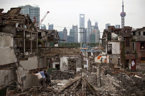 Migrant labourers work at a demolished residential site in Shanghai, China, 5 September 2012 (Photo: Reuters/Aly Song)