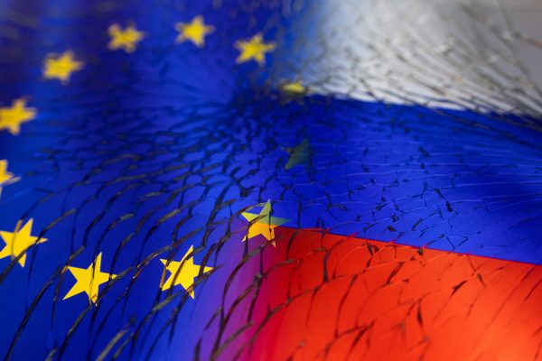 EU and Russian flags are seen through broken glass this illustration taken 13 April 2022. (Photo: Reuters/Dado Ruvic)