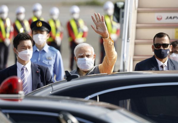 Indian Prime Minister Narendra Modi waves ahead of the Quad Leaders' Summit, between the United States, Japan, India and Australia, at Haneda Airport in Tokyo, Japan, 23 May 2022 (Photo: Reuters/Kyodo).
