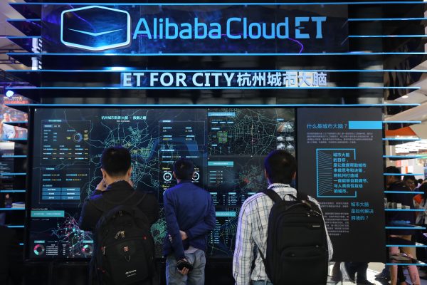 People visit the stand of Alibaba Cloud ET for City during an exhibition in Shanghai, China, 14 October 2016 (Photo: Reuters/Oriental Image).