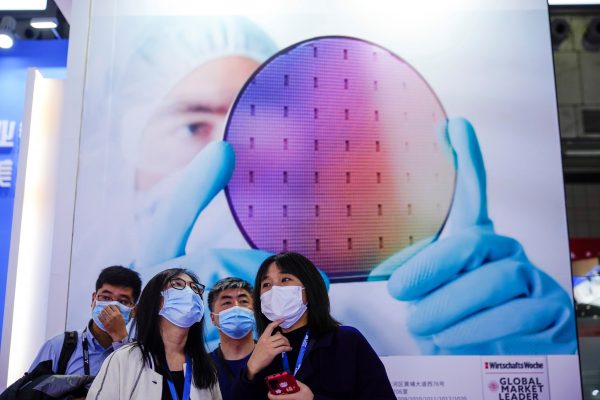 People visit a display at Semicon China, a trade fair for semiconductor technology, Shanghai, China, 17 March, 2021 (Photo: Reuters/Aly Song).