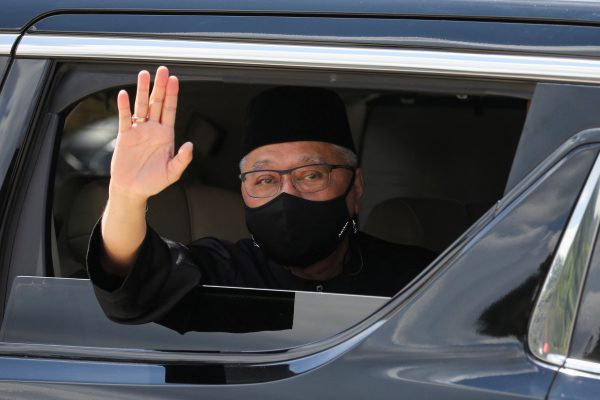 New Malaysian Prime Minister Ismail Sabri Yaakob waves from a car, as he leaves after the inauguration ceremony, in Kuala Lumpur, Malaysia, 21 August 2021 (Photo: Reuters/Lim Huey Teng)