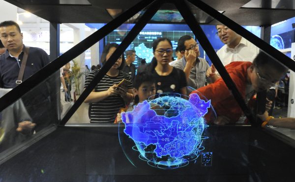 Visitors look at a big data demonstration at the stand of Sinochem during the first Digital China Summit, Fuzhou city, China, 22 April 2018 (Photo: Reuters/Oriental Image).