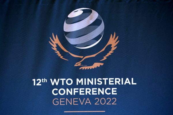 A logo is pictured at the World Trade Organization (WTO) headquarters ahead of the Ministerial Conference (MC12) in Geneva, Switzerland, 12 June 2022 (Photo: Reuters/Denis Balibouse).