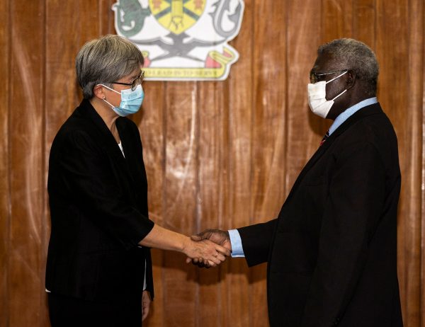 Australia's Foreign Minister Penny Wong shakes hands with Solomon Islands Prime Minister Manasseh Sogavare during their meet in Honiara, Solomon Islands, 17 June 2022. (Photo: Reuters/Australia Department of Foreign Affairs and Trade).