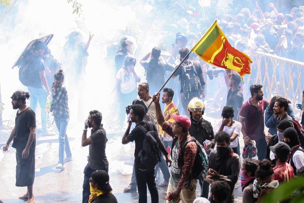 Thousands of anti-government protesters stormed into Sri Lanka's Prime Minister Ranil Wickremesinghe's office hours after he was named as acting President of the country. (Photo: Amitha Thennakoon/Pacific Press/Sipa USA via Reuters).