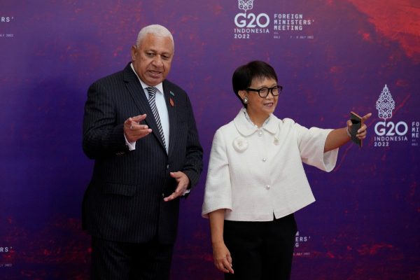 Indonesia's Foreign Minister Retno Marsudi, right, greets Fiji's Prime Minister and Foreign Minister Josaia Voreqe Bainimarama upon arrival at the the G20 Foreign Ministers’ Meeting in Nusa Dua, Bali, Indonesia, 8 July 2022 (Photo: Dita Alangkara/Pool via Reuters).