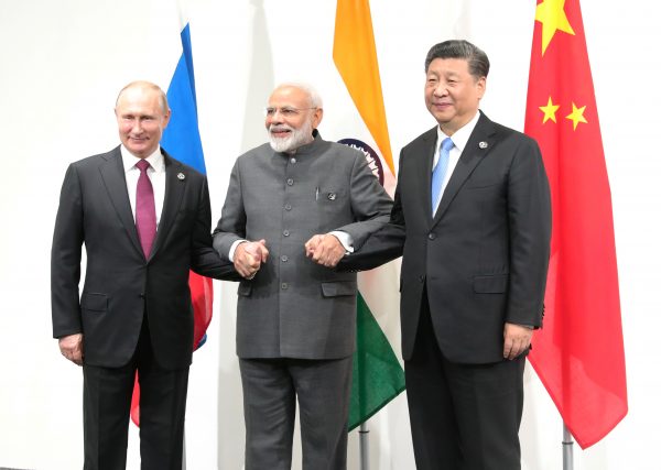 Vladimir Putin, India's Prime Minister Narendra Modi and China’s President Xi Jinping pose for a picture during a meeting on the sidelines of the G20 summit in Osaka, Japan June 28, 2019 (Sputnik/Mikhail Klimentyev).