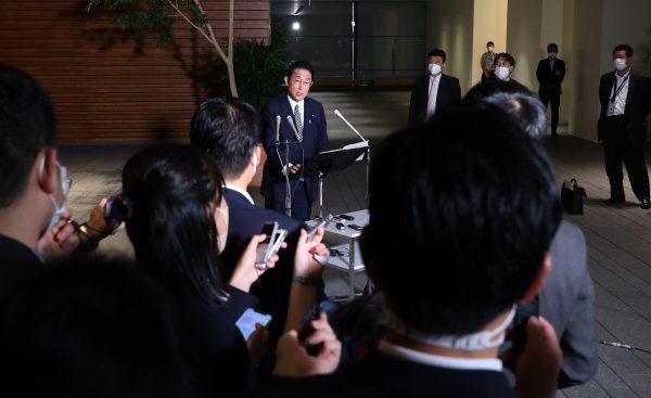 Japanese Prime Minister Fumio Kishida speaks to media after the Liberal Democratic Party (LDP) announced that 179 of the 379 LDP lawmakers were involved in sending congratulatory telegrams to the former Unification Church or attending meetings, in Tokyo, Japan, 8 September 2022 (PHOTO: Masanori Genko / The Yomiuri Shimbun via Reuters Connect)