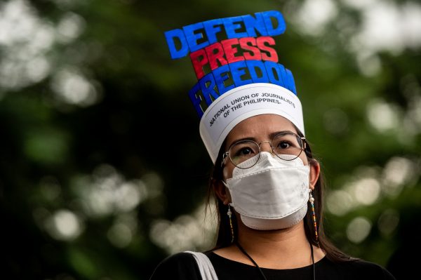 A woman wears a hat with the text “Defend Press Freedom” during a protest commemorating the 50th anniversary of Martial Law, Quezon City, Metro Manila, Philippines, 21 September 2022 (Photo: Reuters/Lisa Marie David)