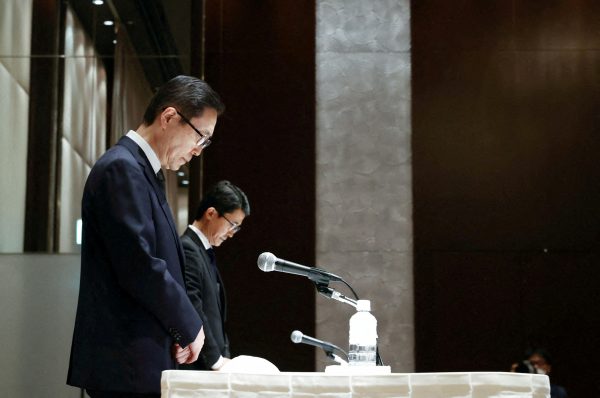Tomihiro Tanaka, president of the Japanese branch of Family Federation for World Peace and Unification, known as the Unification Church, takes part in a moment of silence for former prime minister Shinzo Abe during a news conference in Tokyo, Japan, 11 July 2022 (Photo: Kyodo via Reuters Connect)