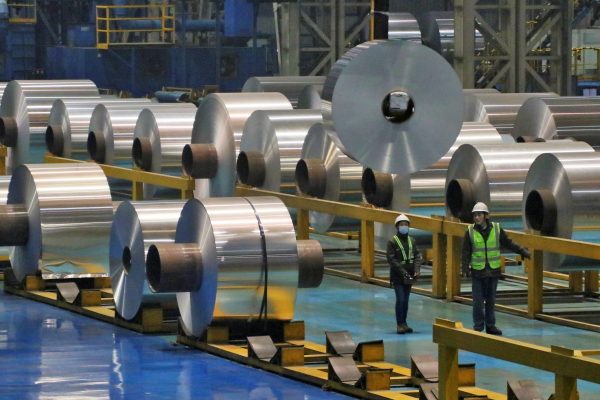 Employees work at the production line of aluminium rolls at a factory in Zouping, Shandong province, China, 23 November 2019 (Photo: Reuters/Stringer).