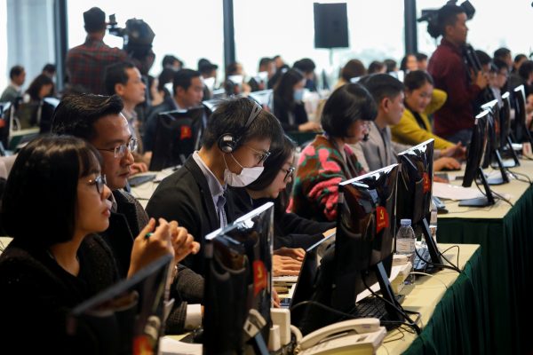 Journalists attend a press conference of 13th national congress of the ruling Communist Party of Vietnam in Hanoi on 22 January 2021. (Photo: Kham/Reuters)
