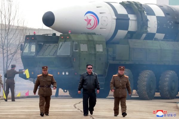 North Korean leader Kim Jong Un walks away from what state media report is a ‘new type’ of intercontinental ballistic missile (ICBM) in this undated photo released on 24 March 2022 (Photo: North Korea's Korean Central News Agency/Reuters).