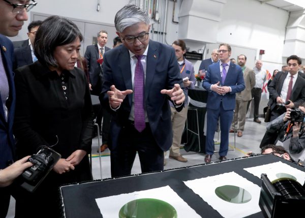 US Trade Representative Ambassador Katherine Tai listens to Jianwei Dong, Chief Executive Officer (CEO) of South Korean semiconductor manufacturer SK Siltron CSS, during a tour of a silicon wafer plant being expanded by SK Siltron CSS in Auburn, Michigan, US, 16 March 2022 (Photo: Reuters/Rebecca Cook).