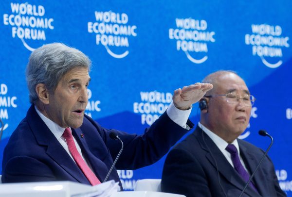US climate envoy John Kerry and China's chief climate negotiator Xie Zhenhua take part in a panel discussion at the World Economic Forum in the Alpine resort of Davos, Switzerland, 24 May 2022 (Photo: Reuters/Arnd Wiegmann).
