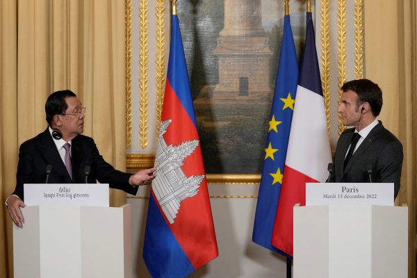 French President Emmanuel Macron, right, and Cambodia's Prime Minister Hun Sen attend a joint press conference prior to their meeting at the Elysee Palace in Paris, France, 13 December 2022. (Photo: Reuters/Francois Mori).