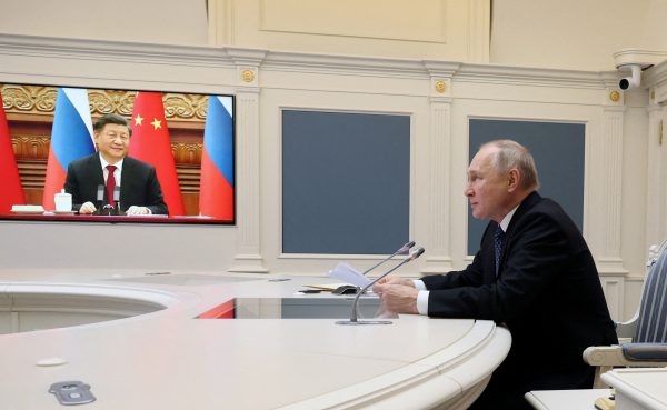 Russia's President Vladimir Putin holds talks with China's President Xi Jinping via a video link from Moscow, Russia, 30 December, 2022 (Photo: Reuters/Mikhail Kuravlev).