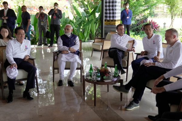 Japanese Prime Minister Fumio Kishida, Indian Prime Minister Narendra Modi, French President Emmanuel Macron, Indonesian President Joko Widodo and Australian Prime Minister Anthony Albanese share a light moment prior to the start of a mangrove planting event at Ngurah Rai Forest Park, on the sidelines of the G20 summit in Denpasar, Bali, Indonesia, 16 November 2022 (Photo: Reuters/Dita Alangkara/Pool).