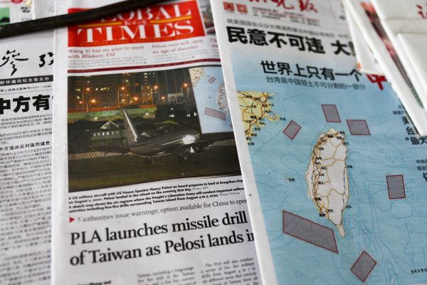 A map showing locations where Chinese People's Liberation Army will conduct military exercises and training activities including live-fire drills is seen on newspaper reports of US House of Representatives Speaker Nancy Pelosi's visit to Taiwan, at a newsstand in Beijing, China, 3 August 2022 (Photo: Reuters/Tingshu Wang).