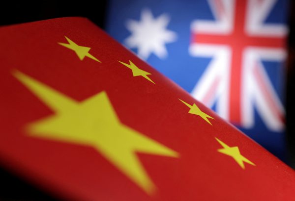 Printed Chinese and Australian flags (Photo: Reuters/Dado Ruvic)
