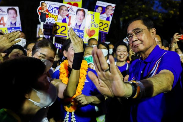Thailand's Prime Minister Prayuth Chan-ocha, the prime ministerial candidate from the United Thai Nation Party (Ruam Thai Sang Chart Party) dances with his supporters during the upcoming general election campaign, in Bangkok, Thailand, 26 April 2023 (Photo: Reuters/Chalinee Thirasupa).