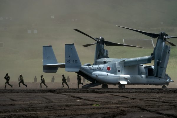 Members of the Japan Ground Self-Defense Force disembark from a V-22 Osprey aircraft during the annual live-fire exercise in Gotemba, Japan, 28 May 2022 (Photo: Tomohiro Ohsumi/Reuters).