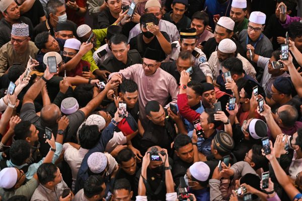 Malaysia's Prime Minister Anwar Ibrahim meets supporters during his first public appearance, attending Friday prayer at a mosque in Putrajaya, Malaysia, 25 November 2022 (Photo: Reuters/Zahim Mohd).