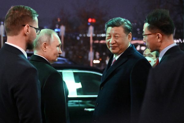 Russian President Vladimir Putin and Chinese President Xi Jinping leave after a reception at the Kremlin in Moscow, Russia 21 March 2023 (Photo: Reuters/Sputnik/Grigory Sysoev/Kremlin)