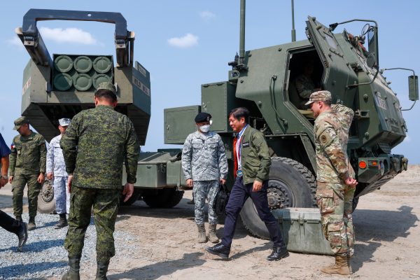 Filipino President Ferdinand Marcos Jr alights from a HIMARS light multiple rocket launcher at a naval base, as he watches the Combined Joint Littoral Live Fire Exercise as part of the US-Philippines Balikatan Exercises, in San Miguel, Zambales, the Philippines, on 28 April 2023 (Photo: Ceng Shou Yi/NurPhoto via Reuters).