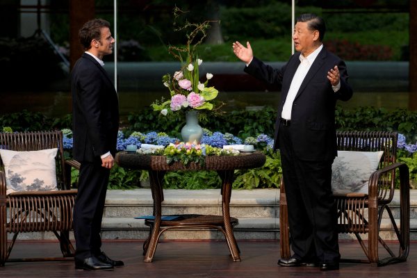 Chinese President Xi and French President Macron talk at a tea ceremony at the Guangdong province governor’s residence in Guangzhou, China, 7 April 2023 (Photo: Reuters/Thibault Camus).