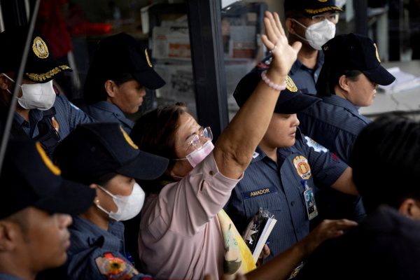 Leila de Lima walks out of the Muntinlupa Hall of Justice surrounded by police, after a hearing on a drugs charge in Muntinlupa, Philippines, 5 June 2023 (Photo: REUTERS/Eloisa Lopez)