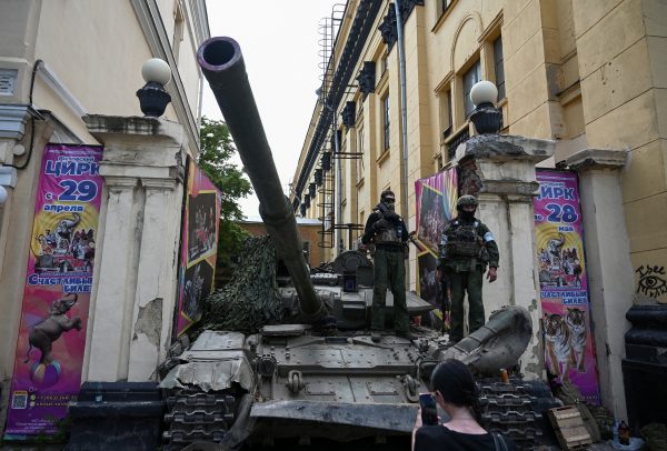 Fighters of Wagner private mercenary group stand on a tank outside a local circus near the headquarters of the Southern Military District in the city of Rostov-on-Don, Russia, 24 June 2023 (Photo: Reuters/Stringer).