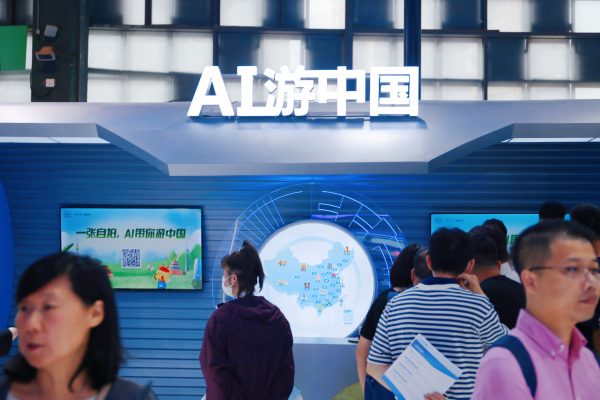 Visitors visit the MIDU booth at the 2023 World Artificial Intelligence Conference in Shanghai, China, 8 July 2023 (Photo: Reuters/CFOTO).