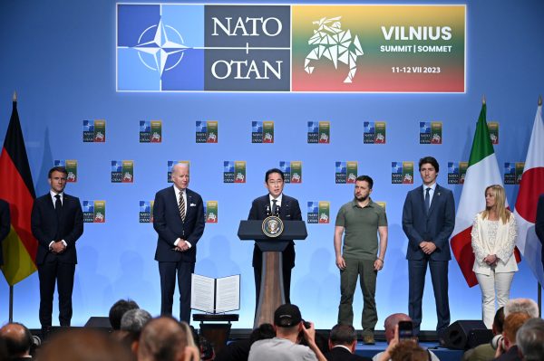 NATO Public Forum 2023 at the Lithuanian Exhibition and Congress Center. G7 countries address a media conference during a NATO summit in Vilnius. From left to right: French President Emmanuel Macron, U.S. President Joe Biden, Japan's Prime Minister Fumio Kishida, Ukrainian President Volodymyr Zelenskiy, Canada's Prime Minister Justin Trudeau, Italian Prime Minister Giorgia Meloni during G7 media conference, Lithuania, Vilnius, 12 July 2023 (Photo: Alexi Witwicki/Reuters).