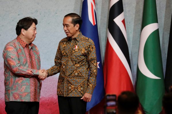 Indonesian President Joko Widodo greets Japan’s Foreign Minister Yoshimasa Hayashi during the Courtesy Call at the Association of Southeast Asian Nations (ASEAN) Foreign Ministers' Meeting in Jakarta, Indonesia, 14 July 2023 (Photo: Reuters/Ajeng Dinar Ulfiana/Pool).