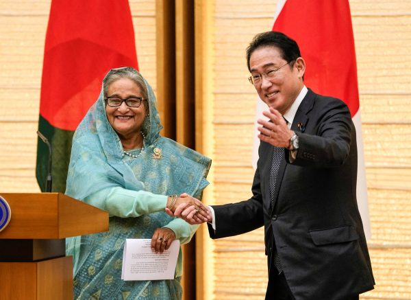 Bangladesh Prime Minister Sheikh Hasina shakes hands with Japanese counterpart Fumio Kishida after signing ceremonies at the latter's official residence in Tokyo, Japan, 26 April 2023. (Photo: Reuters/Kimimasa Mayama)