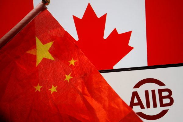 Flags of China and Canada are displayed next to the logo of Asian Infrastructure Investment Bank (AIIB) in this illustration picture taken 15 June 2023 (Photo: Reuters/Florence Lo/Illustration).